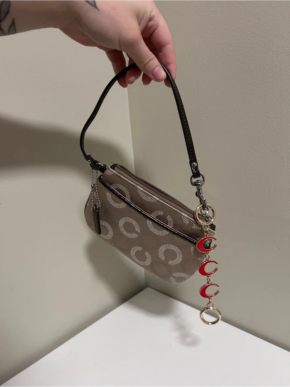 Coach Taupe Signature Canvas Wristlet with Red Charm Accents